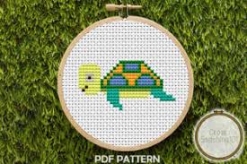 This downloadable cross stitch pattern has instructions on how to make your own turtle with backpack badge. Baby Turtle Modern Cross Stitch Graphic By Crossstitching101 Creative Fabrica
