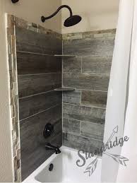Rustic Bathroom Barnwood Ceramic Tile Not A Fan Of The Surrounding Outer Tile Though It Looks A Little Rustic Bathroom Bathrooms Remodel Home Remodeling