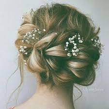 Braided Bun With Baby S Breath Boho Wedding Hair Hair Styles Wedding Hair Flowers