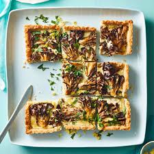 12 Of Our Favorite Recipes To Welcome Spring Goat Cheese Tart Cheese Tarts Stuffed Mushrooms