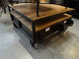 Place end tables separately or together as bunching tables; Industrial Coffee Table Features A Wood Top And Lower Shelf