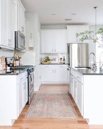 A Rug Can Completely Transform Your Kitchen Take Note Renters Our Rental Home Kitchen Was Black Kitchen Remodel Small Kitchen Renovation Home Decor Kitchen