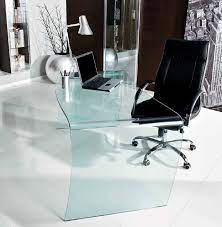 It is compact, but yet very stylish with its signature curved legs, which make it stand out from the surroundings. Unico Italia Magister Glass Desk Office Furniture Ultra Modern Glass Desk Office Glass Office Desk Modern Glass Office