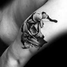A group of orchid flowers is seen as a. 70 Orchid Tattoos For Men Timeless Flower Design Ideas