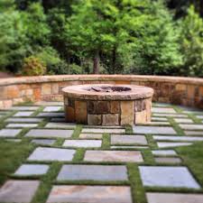 If the grass is wet, it will not burn easily. Falkner Gardens Stone Firepit With Grass Lined Bluestone Surrounding Outdoor Fire Pit Modern Fire Pit Fire Pit Backyard