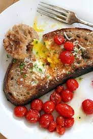 Eggs On A Raft With Sauteed Cherry Tomatoes Recipe Cherry Tomatoes Work Breakfast Cooked Breakfast