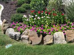 A raised flowerbed not only shows off your flowers by putting them on a pedestal, it also makes gardening easier. Stonework Services Frisco Tx Frisco Masonry Contractors Stone Work