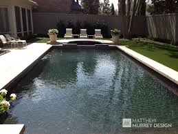 Over time, your pool's plaster can turn rough, unsightly and even dangerous. Classic Contemporary Pool Patterned Concrete Coping Black Onyx Pebble Sheen Plaster Vihara Glass Moa Pool Plaster Above Ground Swimming Pools Swimming Pools