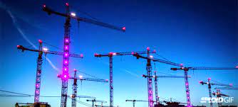 watch construction cranes come to life and dance in a fun light show light show construction crane