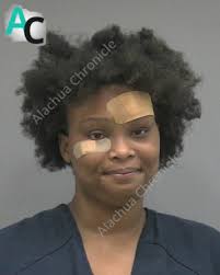 Gainesville woman arrested for burglary and aggravated assault