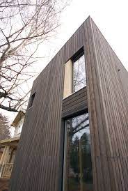 System nail hem provides extra rigidity and wind resistance Knotty Cedar In Stained Ebony With Stainless Steel Nails Wood Siding Exterior Cedar Siding Vertical Wood Siding
