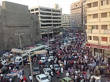From above, the distorted roar of the muezzins' call to prayer. Cairo Wikipedia