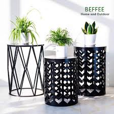 Although your bed side tables don't need to perfectly match the rest of your bedroom furniture, they should be a part of the same while a more traditional look would include a table on either side of the bed, feel free to pair different vintage nightstands together to. Beffee Set Of 3 Light Green Metal Bedside Round Table Outdoor Side Table Wire Plant Stand Wire Side End Table Living Room Garden Accents Wire Stool Bedroom Patio Furniture Accessories Patio