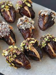 Peanut Butter Stuffed Chocolate Covered Dates This Healthy Table Recipe Dessert Recipes Desserts Snacks