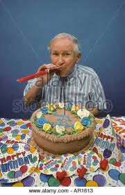 Image result for male 90th birthday cake cakes in 2019 pinterest while its tempting to throw a surprise party consider asking the centenarian to help plan the. 90 Year Old Man Blowing Noisemaker With Birthday Cake Stock Photo Alamy