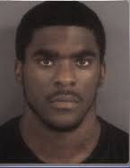 Red Springs man charged with setting dog