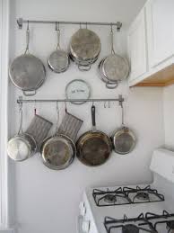 Hanging pot racks add style and function to any kitchen. A 14 Towel Bar Is A Genius Way To Organize Pots And Pans Kitchen Wall Storage Kitchen Cupboards Kitchen Organization Diy
