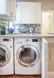 Standard height for wall cabinets is usually 7ft. 9 Small Laundry Room Ideas For The Tiniest Of Apartments Architectural Digest