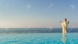 Creating a space with goddess vibes is about more than just the pool itself. Woman In Long Dress Like Greek Goddess Posing Near Edge Of Infinity Stock Photo Picture And Royalty Free Image Image 13294484
