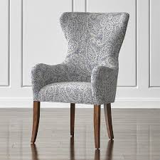 To soften up the look and feel, drape a sheepskin throw over the surface of the dining bench. Denim Blue Paisley Wingback Dining Chair