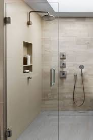 The only visible features are the gaps in the floor through which the water drains. Shower Floor Ideas Which Linear Drain To Choose Luxury Home Remodeling Sebring Design Build