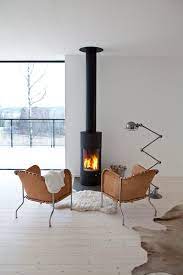 The home is nestled in a wooded lot with beautiful views from every window. 30 Stunning Scandinavian Fireplace Design Ideas To Amaze Your Guests Decor It S Scandinavian Fireplace Fireplace Design Freestanding Fireplace