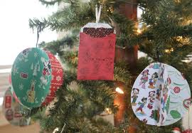 Foam flower gift card holders inserted into a flower pot with plant stakes make a unique gift card tree. Learn How To Make Disney Mickey Friends Cozy Christmas Gift Card Holders Cricut