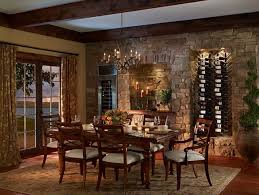 Traditionally Rustic Dining Room With Stone Wall Wine Rack And Bar Wood Ceiling Beams Tuscan Dining Rooms Tuscan Decorating Dining Room Decor Rustic