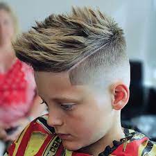 Side swept hair with side fade 50 Cool Haircuts For Boys 2021 Cuts Styles
