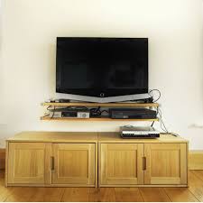 How do i hide a cable box when mounting a tv on the wall? 8 Tips For How To Hide Tv Wires And Other Cords Bob Vila