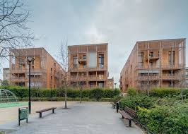Paris Housing Blocks By Tectone Architectes Are Encased By Timber Louvres Urban Design Architecture Architecture Facade