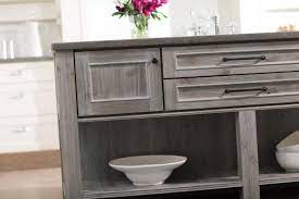 Begin by emptying the cabinets completely and then clean thoroughly, making sure all grease and dirt are gone. Gray Cabinet Finishes Continue To Grow In Popularity Stained Kitchen Cabinets Gray Stained Cabinets Staining Cabinets