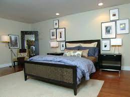 How Art Is Used Asymmetry Off Set By Lamps And Grounded By Night Stands Creates A Symmetrical Arr Modern Guest Bedroom Guest Bedroom Decor Small Guest Bedroom