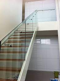 Glass railing post system is a strong option for modern and contemporary homes and buildings. Glass Balustrade For Stairs With Side Mount Stainless Steel Handrail Balustrade Design Glass Staircase Railing Glass Staircase