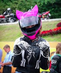 The body of it is black, but it has magenta stripes that swoop up from the sides and up the back to the ears, which are outlined in the same magenta. 14 Cat Ear Motorcycle Helmets Ideas Motorcycle Helmets Cat Ears Motorcycle