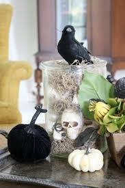 Spooky Halloween Decor A Vase Full Of Mini Skulls And Spanish Moss Make For A Great H Halloween Centerpiece Scary Halloween Decorations Halloween Decorations