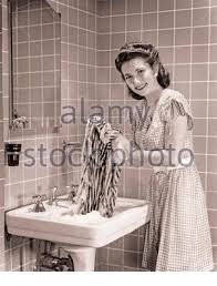 The bathroom stayed in disarray for about 9 months we wanted to keep the integrity of the home's 1940's character. 1940s Woman In The Bathroom A Young Blonde Woman Is Standing In The Bathtub To Have Bath Or A Shower She Has A Towel Around Her Body Sweden 1949 Photo Kristoffersson Ref