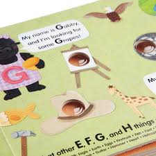 See the pictures, say the words, and poke the irresistible buttons on every page to hear satisfying clicks and pops. Poke A Dot An Alphabet Eye Spy Board Book Melissa Doug Bens