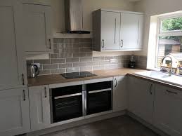 Light grey gloss kitchen with oak worktop 40mm = cmp. Light Grey Matt Shaker With Grey Oak Effect Worktop Bluewater Bathrooms Kitchens