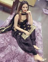 To give an outstanding look to this glossy material, a halter neck designed blouse pattern is sold in the market where the shoulders straps run around. Buy Plain Black Suit For Girls Cheap Online