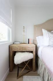Gold Sheepskin Stool Tucked Under Nightstand Transitional Bedroom