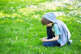 While the top 7, 8, and 9 year old boy haircuts are basically the same as the best 10, 11, and 12 year old boy haircuts, there are definitely some edgy good hairstyles for older boys worth exploring. Young Boy Using Smart Phone At Spring Glade Cute 11 Years Old Boy Sitting On Green Grass At Spring Park Kid S Outdoor Portrait Stock Photo Picture And Royalty Free Image Image 103692659