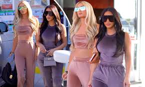 While leaving her hotel, the tv star was photographed wearing a ruched velvet dress with a single sleeve. Kim Kardashian And Her Old Boss Paris Hilton Serve Early 2000s Vibes In Velour Tracksuits Daily Mail Online