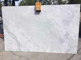 Granite countertops offer a natural appeal that provides durability and beauty at the same time. Super White Granite Features Smooth Patterns Of Gray Across A White Background Super White Slab Is High Kitchen Countertops Countertops Kitchen Inspirations