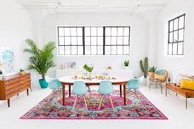 Colorful chairs and rug around a white dining table 20 Enchanting Bohemian Dining Room Designs Home Design Lover