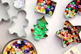 Remove red, white, and green bake shop clay from packaging and knead in your hands until conditioned and pliable. Handmade Beaded Christmas Ornaments Kids Can Make
