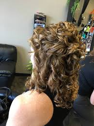 As you tie the elastic around for the final time, leave the ends tucked in to create a small bun. Updo Curly Hairstyles