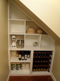 This pantry under the stairs features beadboard, open shelves, and plenty of organization. Kitchen Pantry Shelving Creates Great Additional Storage Space In A Small Closet Under An Exis Closet Under Stairs Under Stairs Pantry Small Apartment Closet