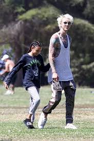 Machine gun kelly surprised fans as he debuted a freshly shaved head on his instagram, one day after getting matching tattoos with travis barker. Machine Gun Kelly 30 Spends Time With Daughter Casie 11 At La Park On Father S Day Daily Mail Online