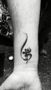 The flow of this tattoo is just amazing. 35 Religious Wrist Tattoos For Men